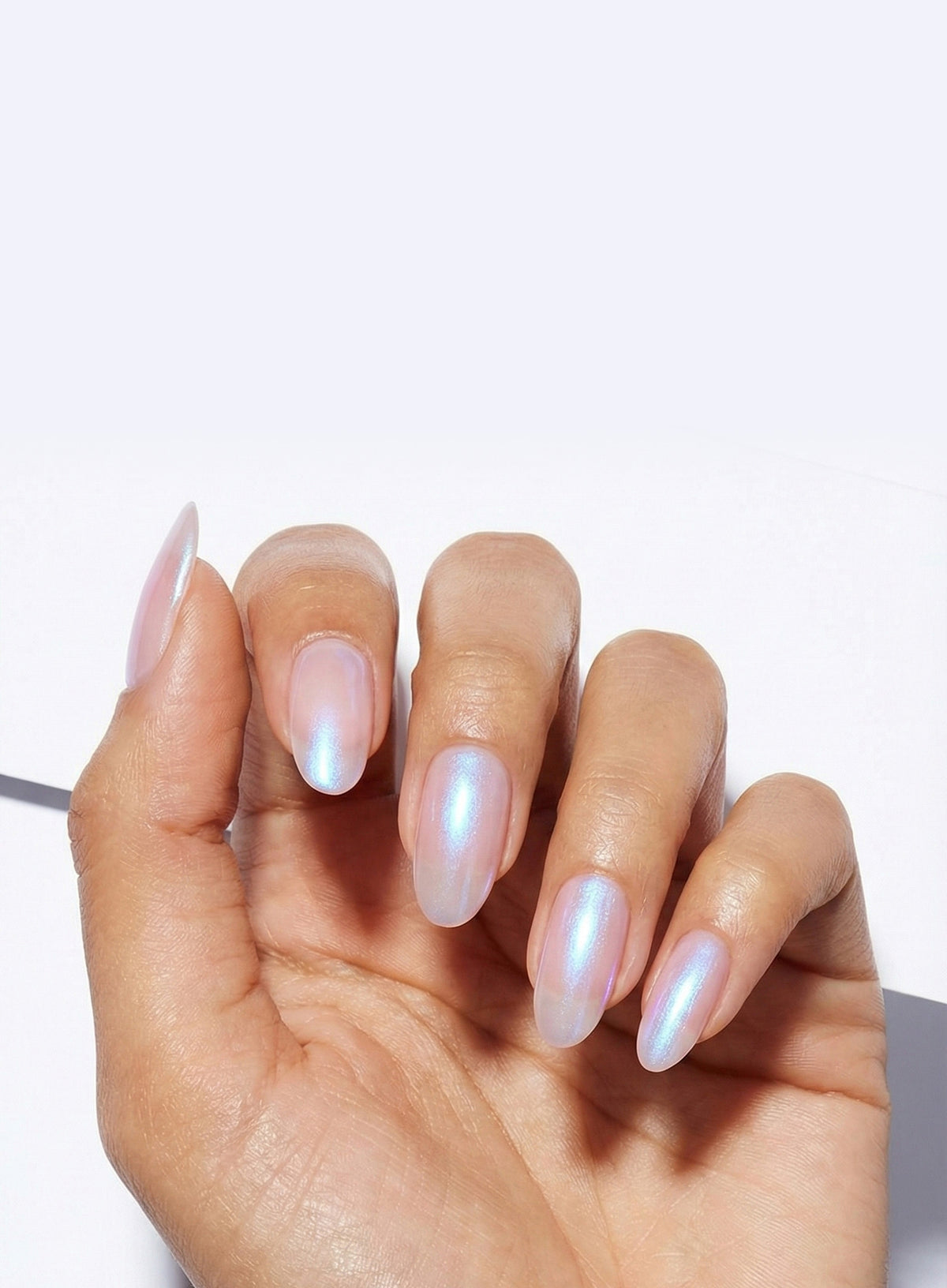 A close-up of a hand with Perfection Gel Coat applied to nails.