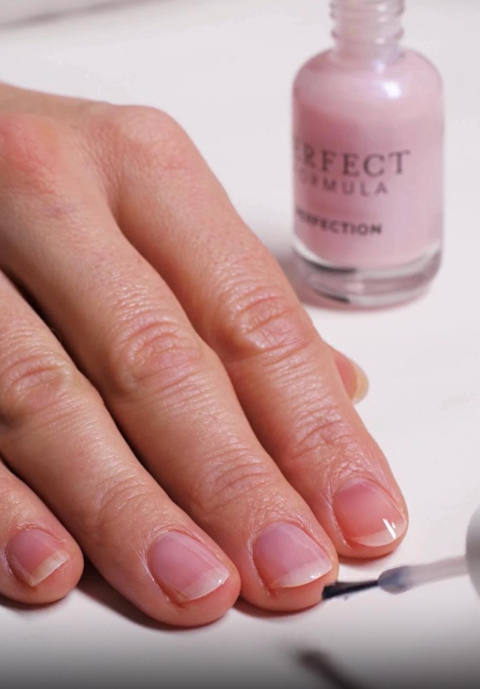 Demonstration of Perfection being applied onto the nails.